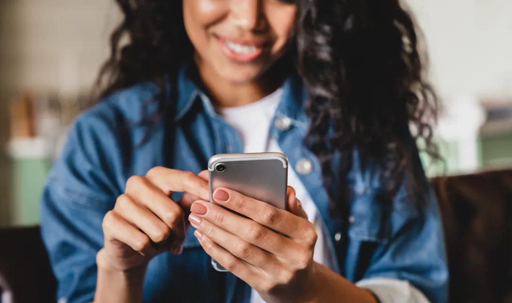 Woman looking at mobile device.