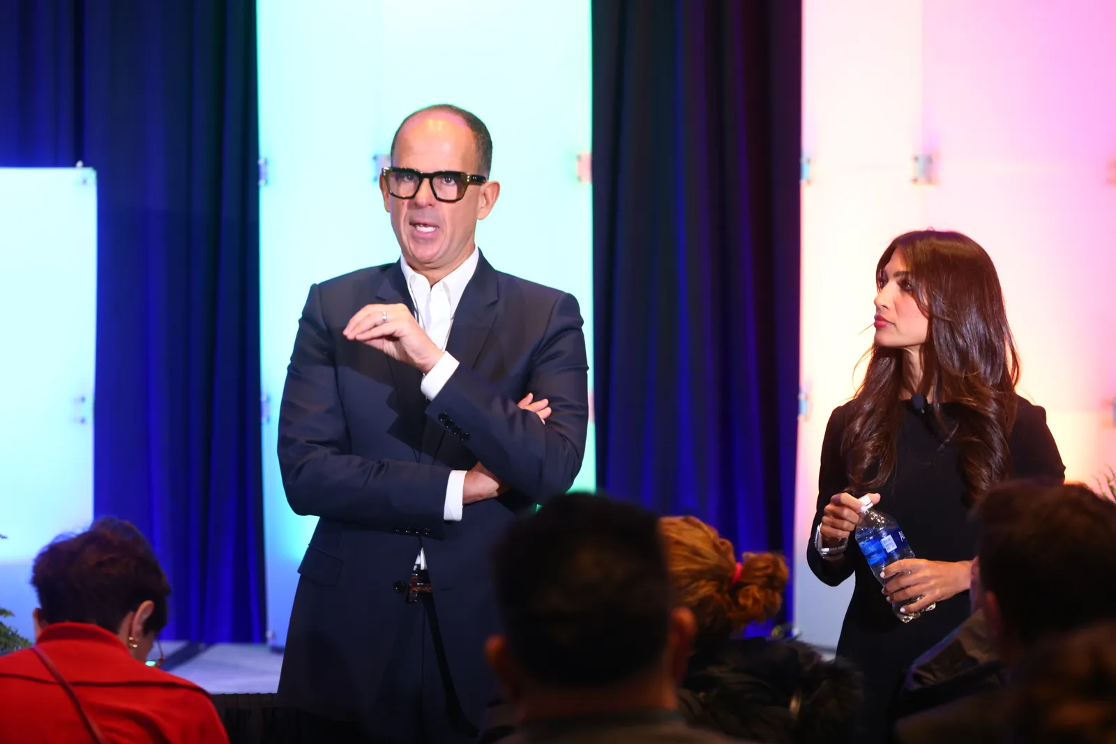 Beyond Inc. executives Marcus Lemonis and Chandra Holt speaking at a trade show